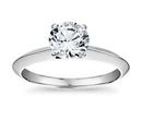 A brilliant round-cut diamond engagement ring with knife-edge platinum band
