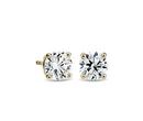 A pair of birthstone diamond stud earrings with round brilliant-cut diamonds set with yellow gold posts