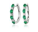 May birthstones featured in an alternating emerald and diamond huggie hoop earring in white gold