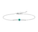 A emerald birthstone bracelet showcasing a round brilliant-cut gemstone centered in a diamond pavé bar decorating a white gold chain