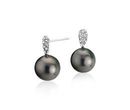 A pair of gray-black Tahitian cultured pearls suspended from a cluster of diamonds arranged in a teardop set in white gold