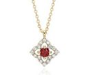 A floral, vintage-inspired birthstone pendant with round ruby center framed in diamond micropavé petals set in yellow gold and suspended from matching cable chain