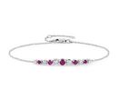 A birthstone bracelet of brilliant-cut graduated prong-set rubies and diamonds set against white gold, on a cable chain