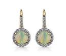 A pair of birthstone earrings with oval milky white opals surrounded in micro-pavé halo and diamond detail set into the yellow gold setting