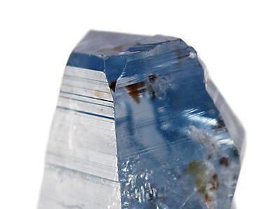 A sapphire gemstone in unpolished crystal form
