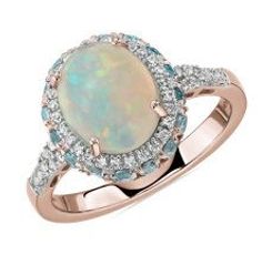 Oval Opal and Swiss Blue Topaz Halo Ring