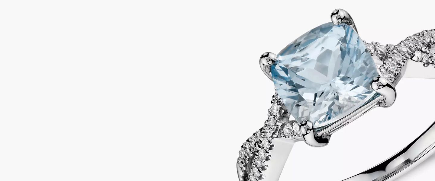 A cushion cut aquamarine engagement ring set up twisted diamond pave white gold setting