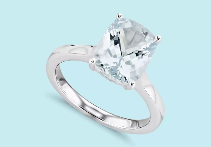 A large cushion cut aquamarine engagement ring in white gold