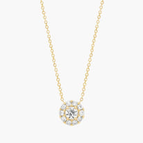 Gold necklace with a diamond cluster pendant.