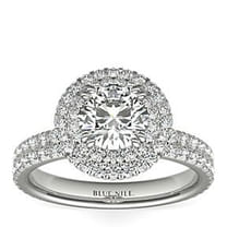Sparkling diamond engagement ring with halo setting and pavé band.