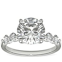 Elegant diamond ring with round solitaire and accent stones