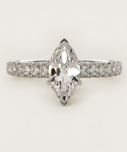 Marquise cut diamond engagement ring with pavé band.