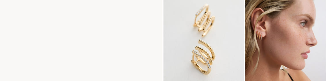 Gold hoop earrings with gemstones shown alone and worn by a person.