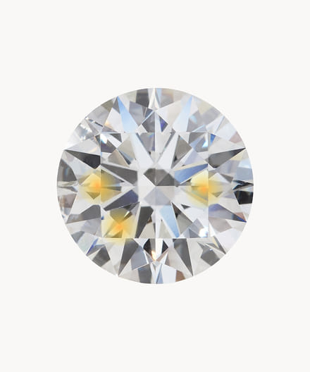 Close-up of a sparkling round diamond with faceted cuts reflecting light.
