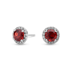 Elegant red gemstone stud earrings with diamond accents.