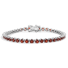 Silver chain bracelet with red gemstones set in a linked pattern.