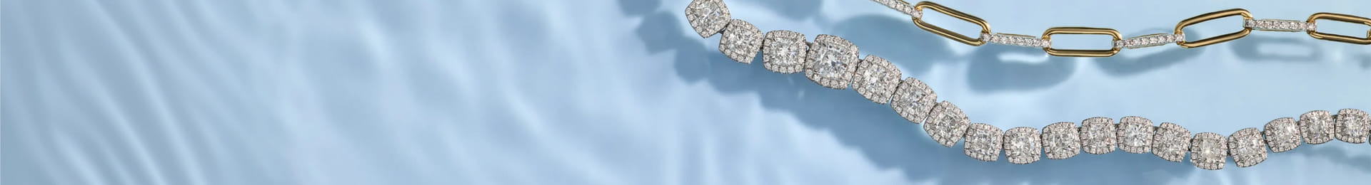 Gold and diamond chain on a blue silky background.