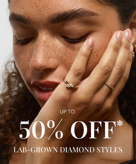 Woman with lab-grown diamond rings and closed eyes, 50% off promotion