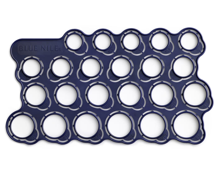 Dark blue plastic ring size guide with multiple circular holes for measurement.